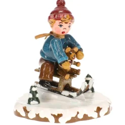 Winterkinder Schlittenfahrer